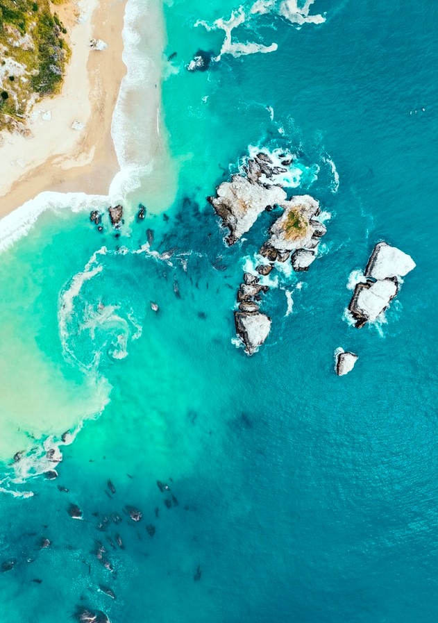 aerial view of rocks and sea shore 